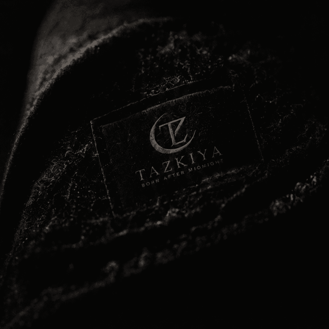 TAZKIYA woven label on heavy black cotton